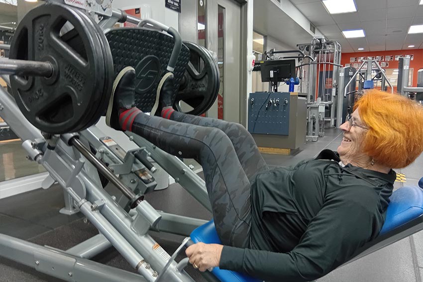 A person exercising in the Never2old programme, using an exercise machine at the AUT gym