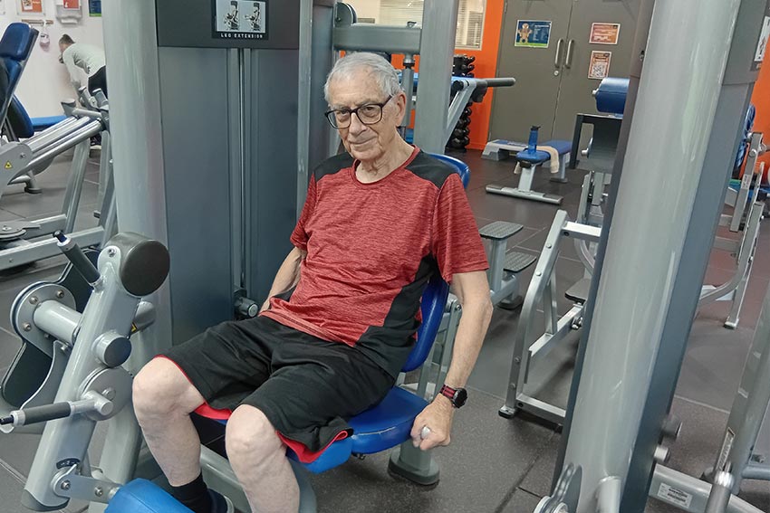 A person exercising in the Never2old programme, using an exercise machine at the AUT gym
