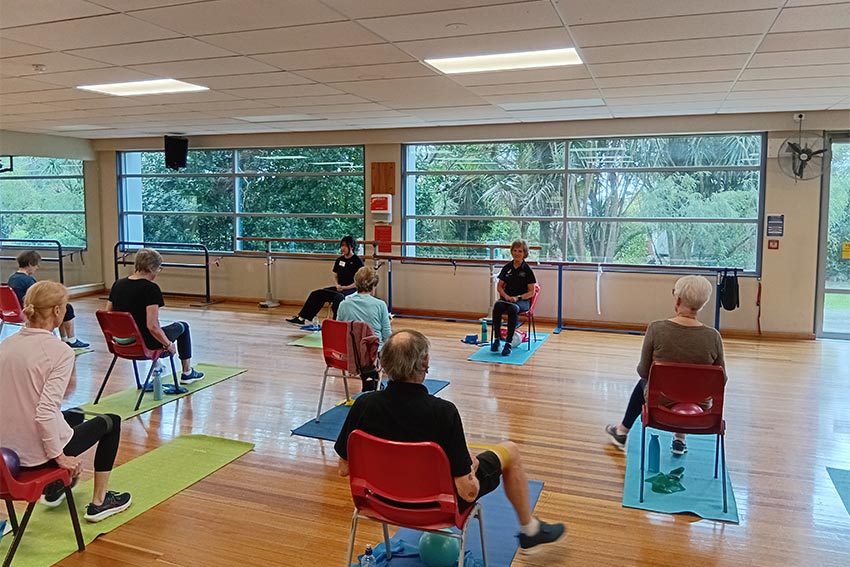 A person exercising in the Never2old programme, using an exercise machine at the AUT gym